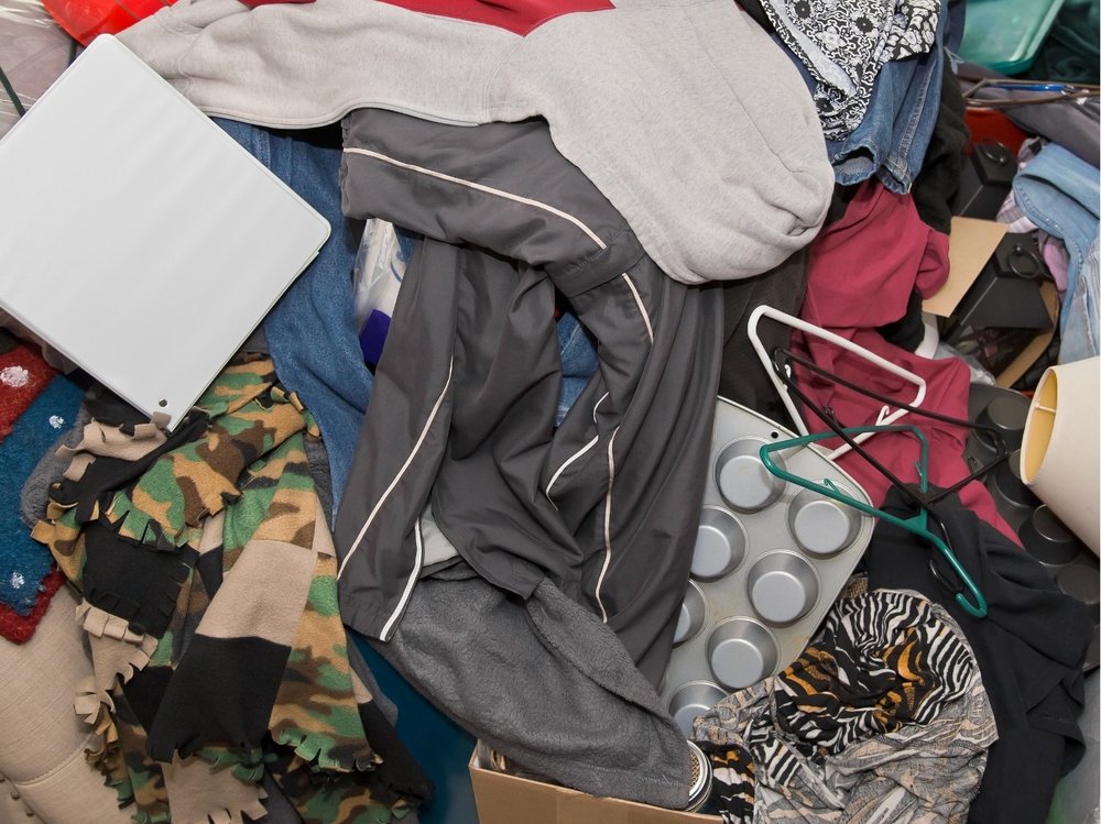 Close-up of a cluttered space before cleanup